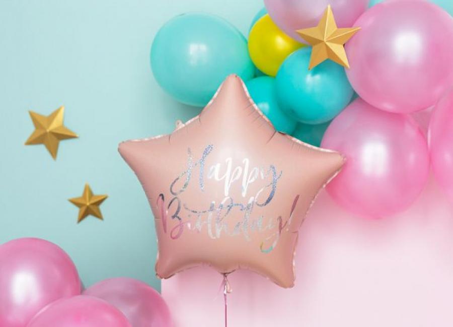 Foliopallo tähti vaaleanpunainen hohtavalla "Happy Birthday"-tekstillä